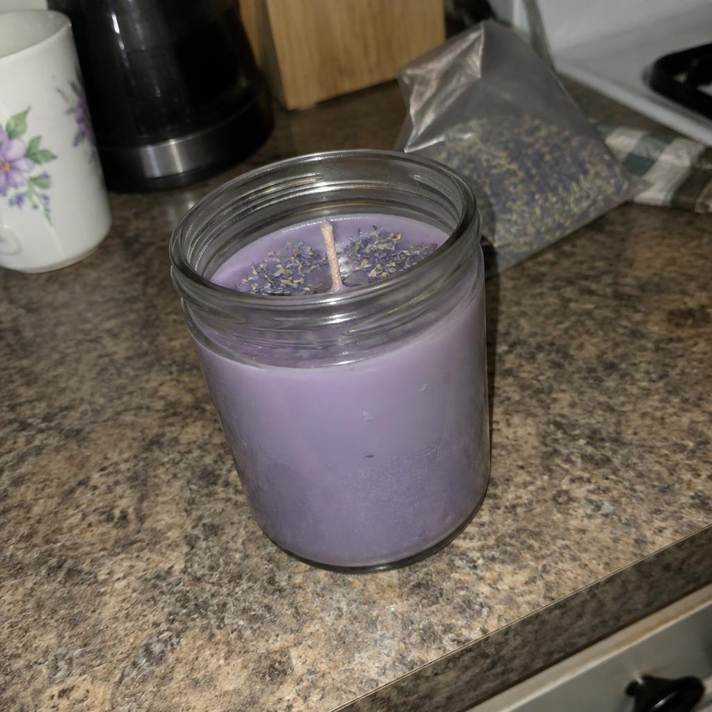 Original phone snapshot of a candle on a kitchen counter
